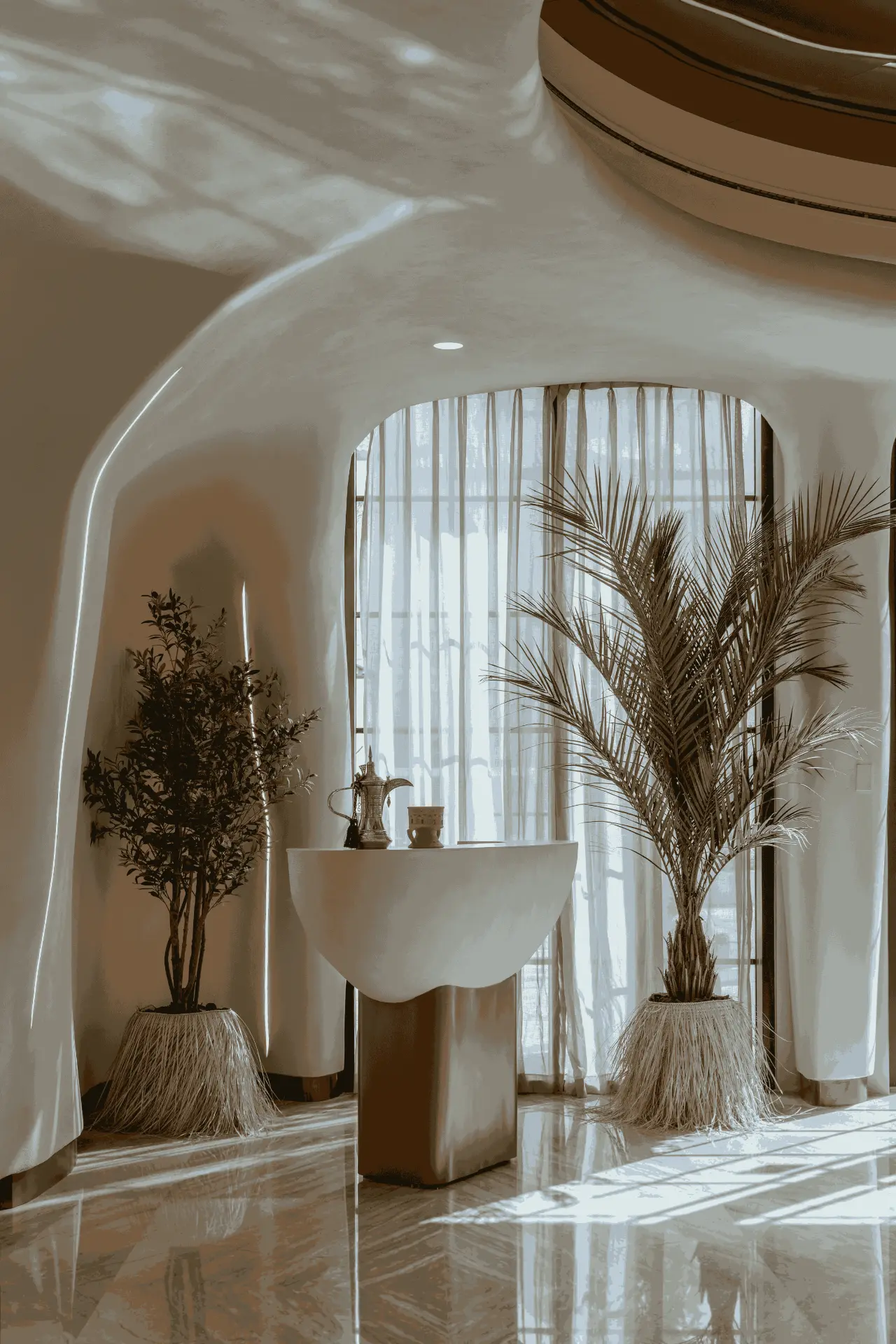 Falwa foyer with sculpted host stand and palms